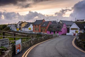 a street in a town with colorful houses at The Pipers Rest in Doolin