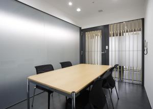 a conference room with a table and chairs at HOTEL MYSTAYS Ochanomizu Conference Center in Tokyo