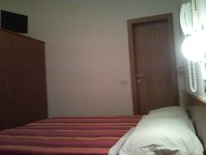Postel nebo postele na pokoji v ubytování Hotel Trinidad