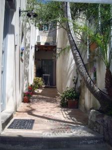 a street scene with a building and a flower pot at Residence Acanto in Lipari