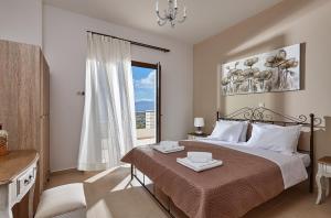 Posteľ alebo postele v izbe v ubytovaní Orelia Cretan Deluxe Apartments + 37 fotografií
