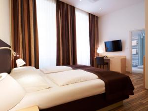 Voodi või voodid majutusasutuse Hotel Zipser toas
