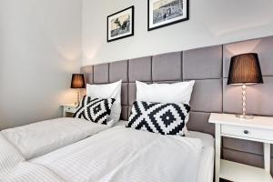Posteľ alebo postele v izbe v ubytovaní Grand Apartments Wave- Na Fali