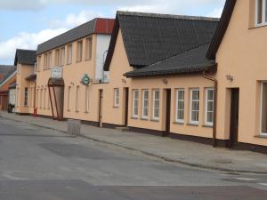 a row of buildings on the side of a street at Hotel Gedser Apartments in Gedser