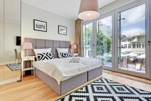 Posteľ alebo postele v izbe v ubytovaní Grand Apartments Wave- Na Fali