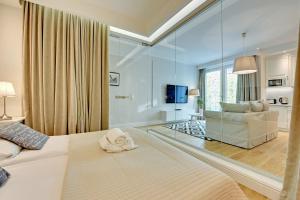 Posteľ alebo postele v izbe v ubytovaní Grand Apartments Wave- Na Fali