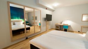 Postel nebo postele na pokoji v ubytování Thon Hotel Nordlys