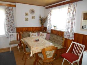 a living room with a table and a couch at Chalupa Anton in Horní Halže