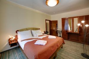 Posteľ alebo postele v izbe v ubytovaní Parkhotel Forest