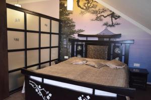 מיטה או מיטות בחדר ב-Golden Palace