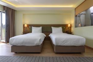 Postel nebo postele na pokoji v ubytování Numi Hotel