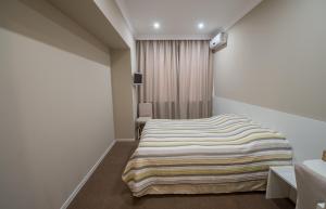 Postel nebo postele na pokoji v ubytování light hotel & hub