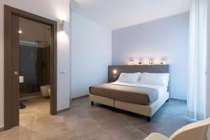 Postel nebo postele na pokoji v ubytování Hotel Eden + 21 fotografií