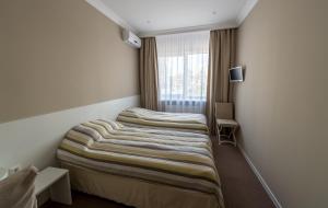 Postel nebo postele na pokoji v ubytování light hotel & hub