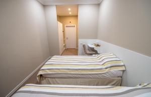 Postel nebo postele na pokoji v ubytování light hotel & hub