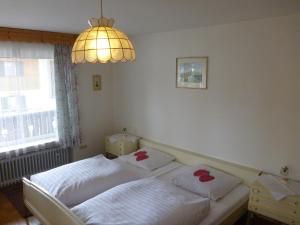 Кровать или кровати в номере Gästehaus Andreas Hofer +7 фотографий