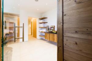 a hallway with a wooden wall in a house at Hotel Aichingerwirt in Mondsee