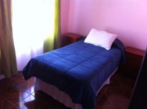 Postel nebo postele na pokoji v ubytování Hotel Altos de Atacama