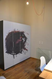 a room with a large painting on a wall at Maison am Liesingbach in Vienna