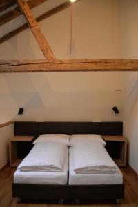 a room with two beds in a attic at Maison am Liesingbach in Vienna
