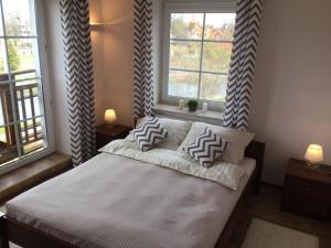 Posteľ alebo postele v izbe v ubytovaní Apartament VIP Vęgoria
