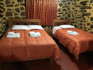 Postel nebo postele na pokoji v ubytování Rumi Sonqo Hostel