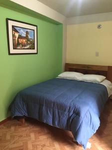 Postel nebo postele na pokoji v ubytování Rumi Sonqo Hostel