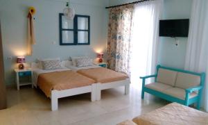 A bed or beds in a room at Idi