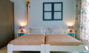 Ένα ή περισσότερα κρεβάτια σε δωμάτιο στο Ίδη