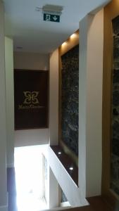 a sign on the wall of a hotel room at Horta Garden in Horta
