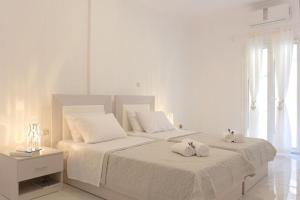 Säng eller sängar i ett rum på Elia Sea View Apartment