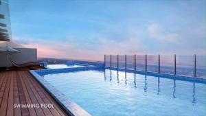 a swimming pool with a view of the ocean at Pearltree Hotels And Resorts in Purulia
