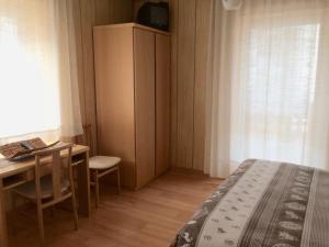 Postel nebo postele na pokoji v ubytování Garnì Serena