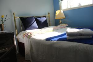 Postel nebo postele na pokoji v ubytování Winnipeg Homestay