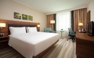 a hotel room with two beds and a television at Hilton Garden Inn Moscow Krasnoselskaya in Moscow