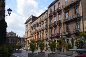 a row of buildings on a city street at B&B Chapo in Catania