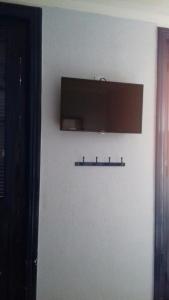 a shelf on a wall with a light on it at Hotel Michel in São Paulo +27 photos