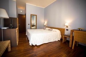 Postel nebo postele na pokoji v ubytování Hotel Cetarium