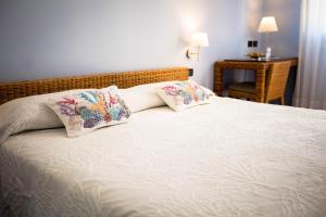 Postel nebo postele na pokoji v ubytování Hotel Cetarium