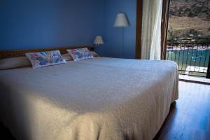 Postel nebo postele na pokoji v ubytování Hotel Cetarium