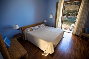 Postel nebo postele na pokoji v ubytování Hotel Cetarium