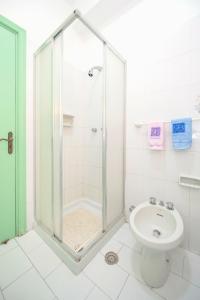 a bathroom with a shower and a toilet and a sink at Villa Angela Apartment in Ischia Town +23 photos