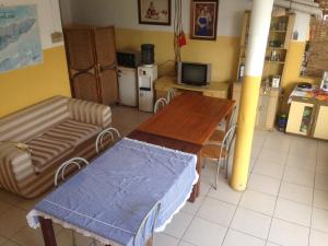 a living room with a table and a couch at Vila Bemori in Dili