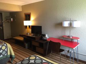 A television and/or entertainment centre at Super 8 by Wyndham Redfield
