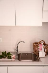 a kitchen sink with a basket next to it at La Torretta in Imperia