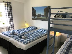 Postel nebo postele na pokoji v ubytování Hallandsgården by Mellbystrands