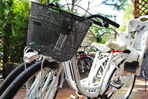 two bikes parked next to each other with a basket at Hotel Saint Tropez in Riccione