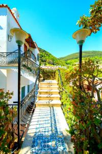 a stairway leading up to a building with two lights at Villa Angela Apartment in Ischia Town