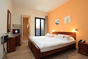Letto o letti in una camera di Osteria Ticino by Ketty & Tommy