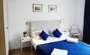 Кровать или кровати в номере Hostal Porto Mar